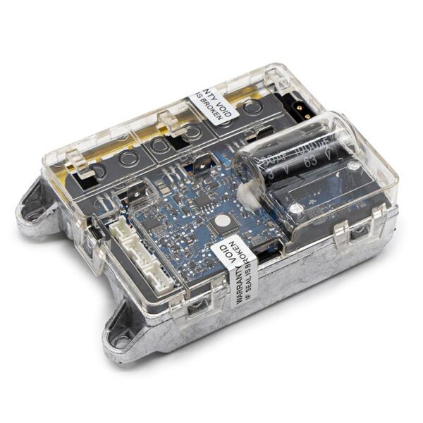 Contrôleur Xiaomi M365 de trois quarts, boîtier aluminium et capot transparent laissant voir la carte Contrôleur Xiaomi M365 de trois quarts, boîtier aluminium et capot transparent laissant voir la carte