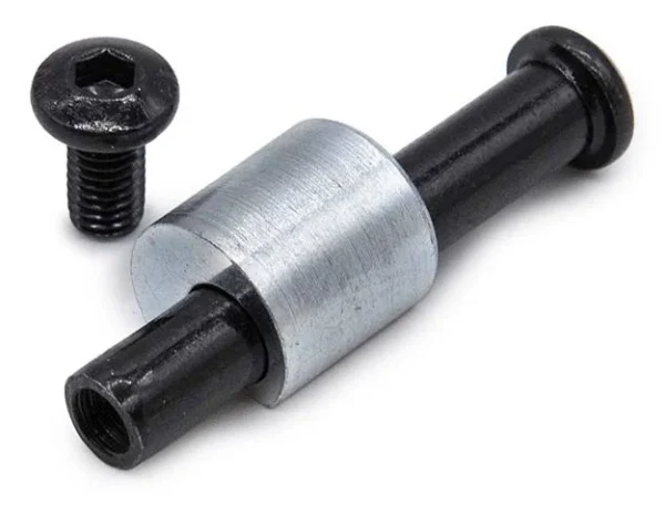 Axe de pliage noir avec son entretoise en place et sa vis posée à côté Axe de pliage noir avec son entretoise en place et sa vis posée à côté