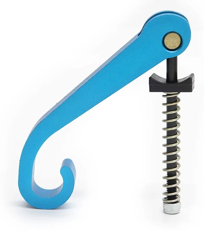 Levier de pliage bleu vu de profil, avec son axe, sa butée noire, son ressort et sa vis