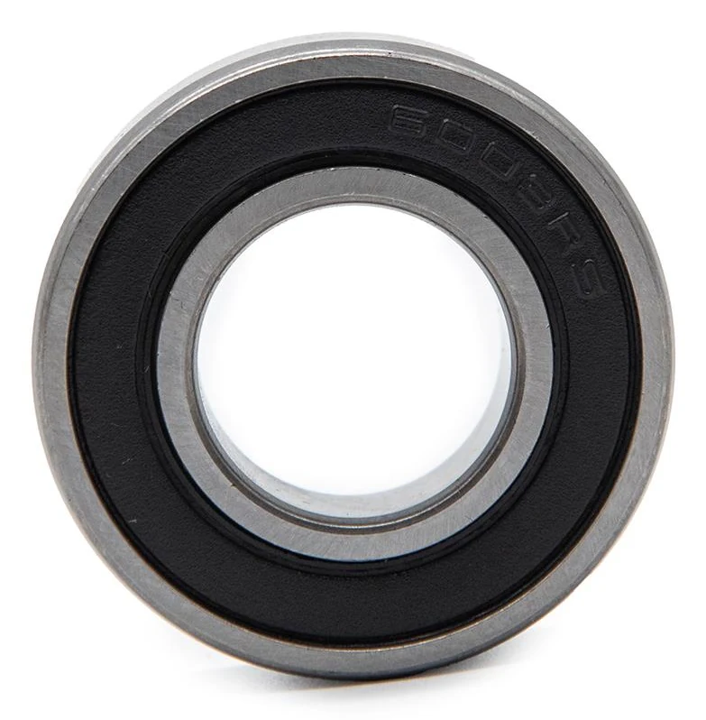 Roulement à billes vu de face, joint souple noir marqué 6003RS en creux autour de l'alésage central