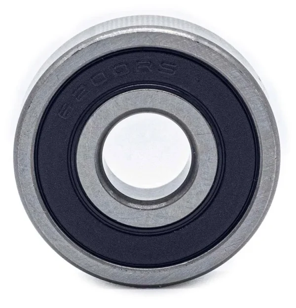 Roulement à billes vu de face : bague extérieure épaisse, joint souple noir marqué 6200RS, alésage central Roulement à billes vu de face : bague extérieure épaisse, joint souple noir marqué 6200RS, alésage central