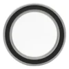 Roulement à billes vu de face : bague mince, joint souple noir avec un marquage en creux, large alésage central Roulement à billes vu de face : bague mince, joint souple noir avec un marquage en creux, large alésage central