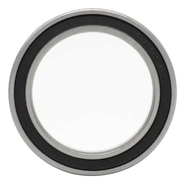 Roulement à billes vu de face : bague mince, joint souple noir avec un marquage en creux, large alésage central Roulement à billes vu de face : bague mince, joint souple noir avec un marquage en creux, large alésage central