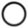 Roulement à billes vu de face : bague extérieure rectifiée, joint souple noir et large alésage central Roulement à billes vu de face : bague extérieure rectifiée, joint souple noir et large alésage central