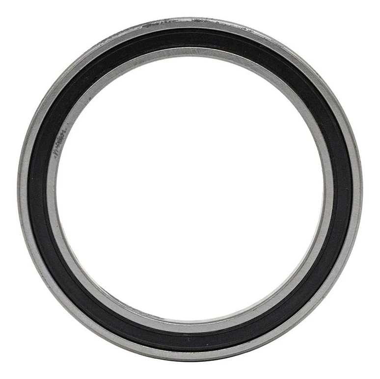 Roulement à billes vu de face : bague extérieure rectifiée, joint souple noir et large alésage central